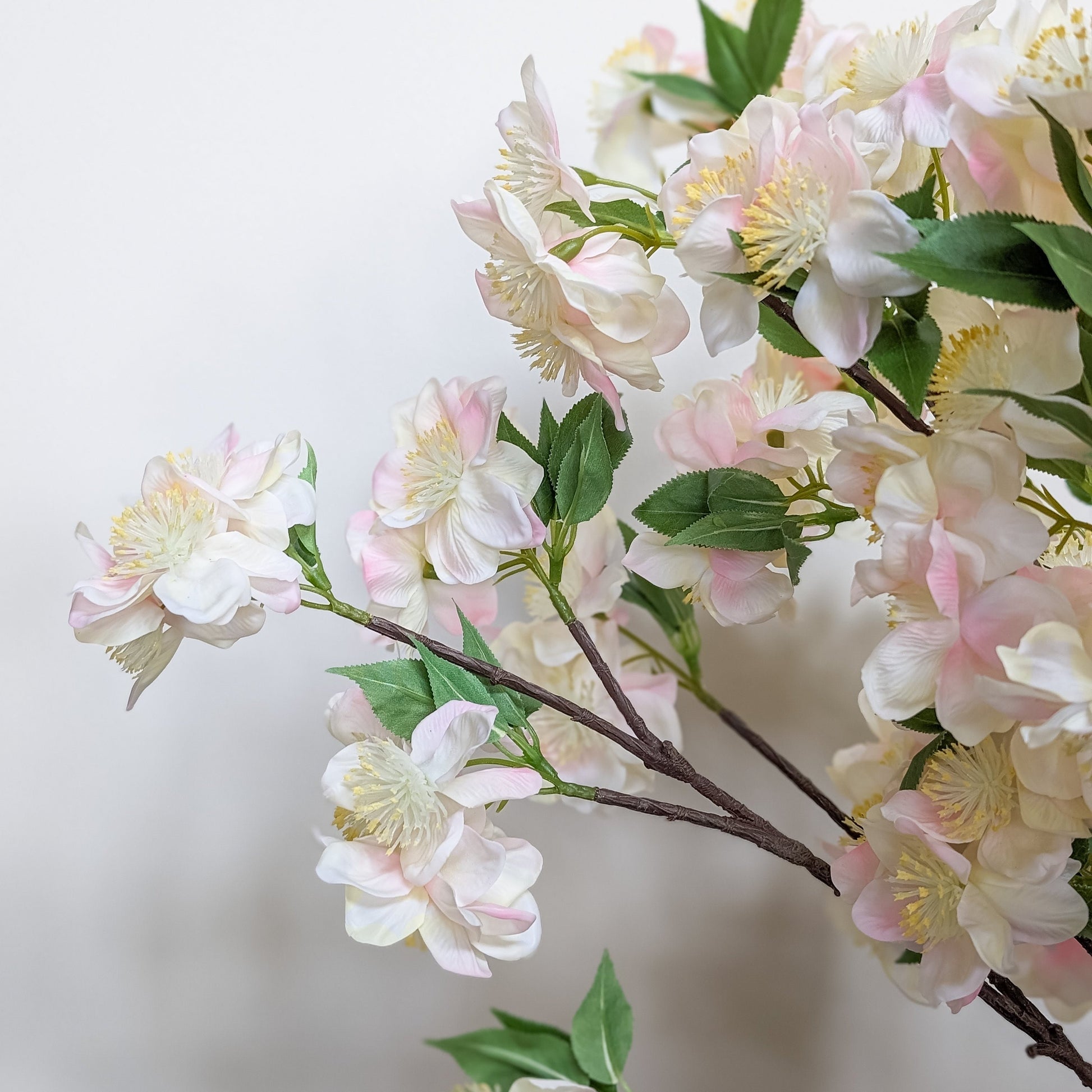 Realistic artificial apple blossom stem with real touch petals with gradient of pink and white petals