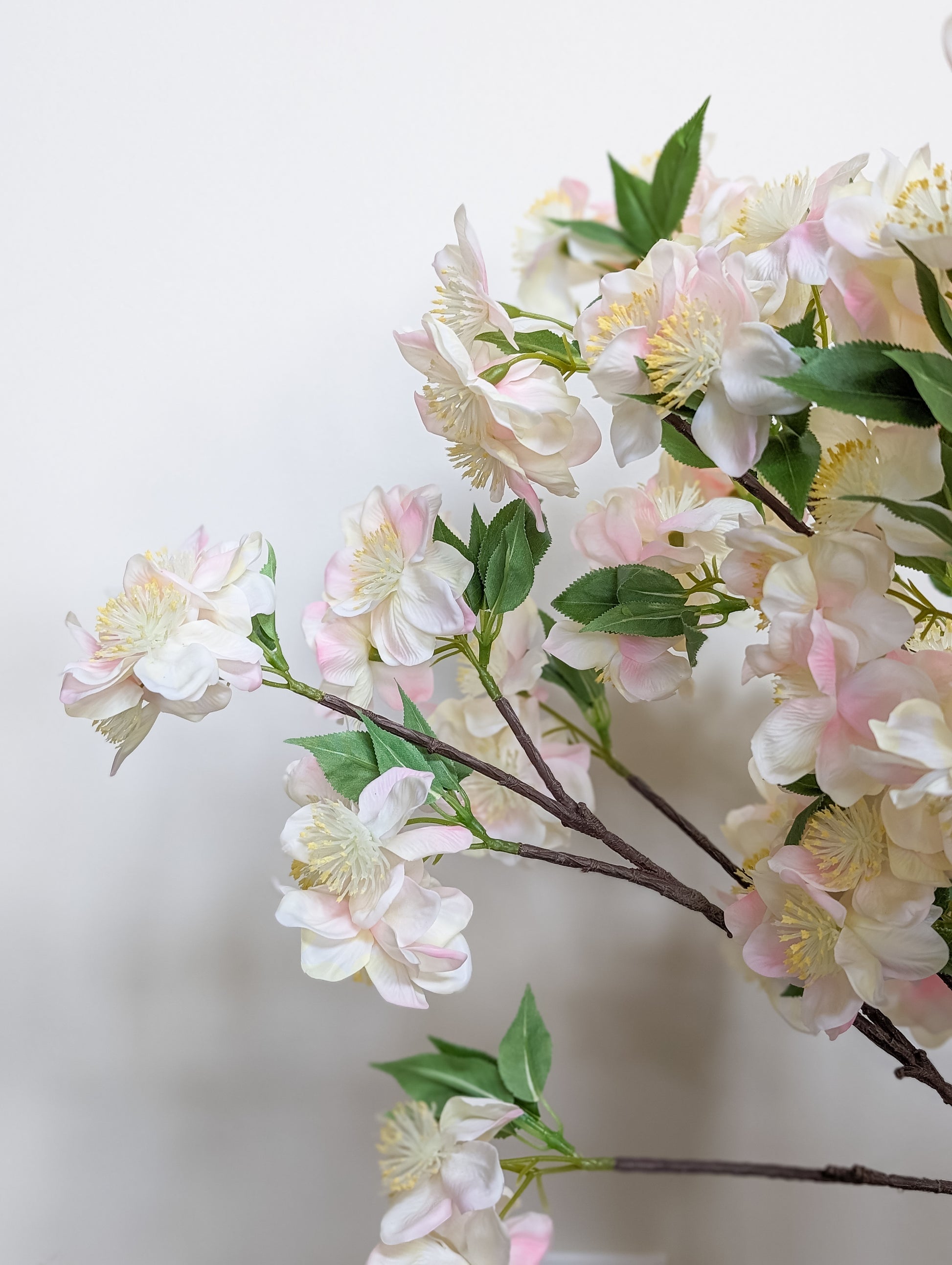 Realistic artificial apple blossom stem with real touch petals with gradient of pink and white petals