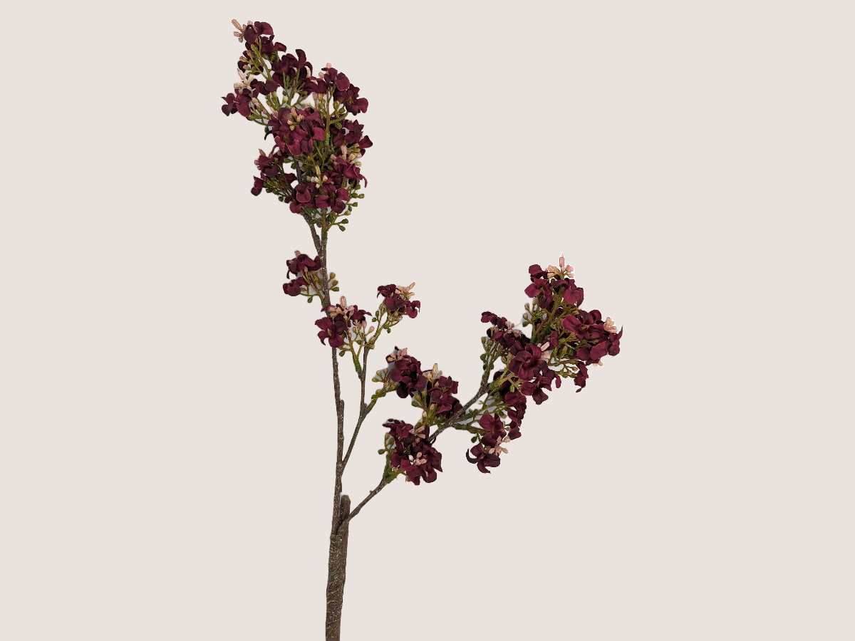 Faux floral dark pink burgundy fall stem with light pink accents and realistic branch against a beige backdrop.