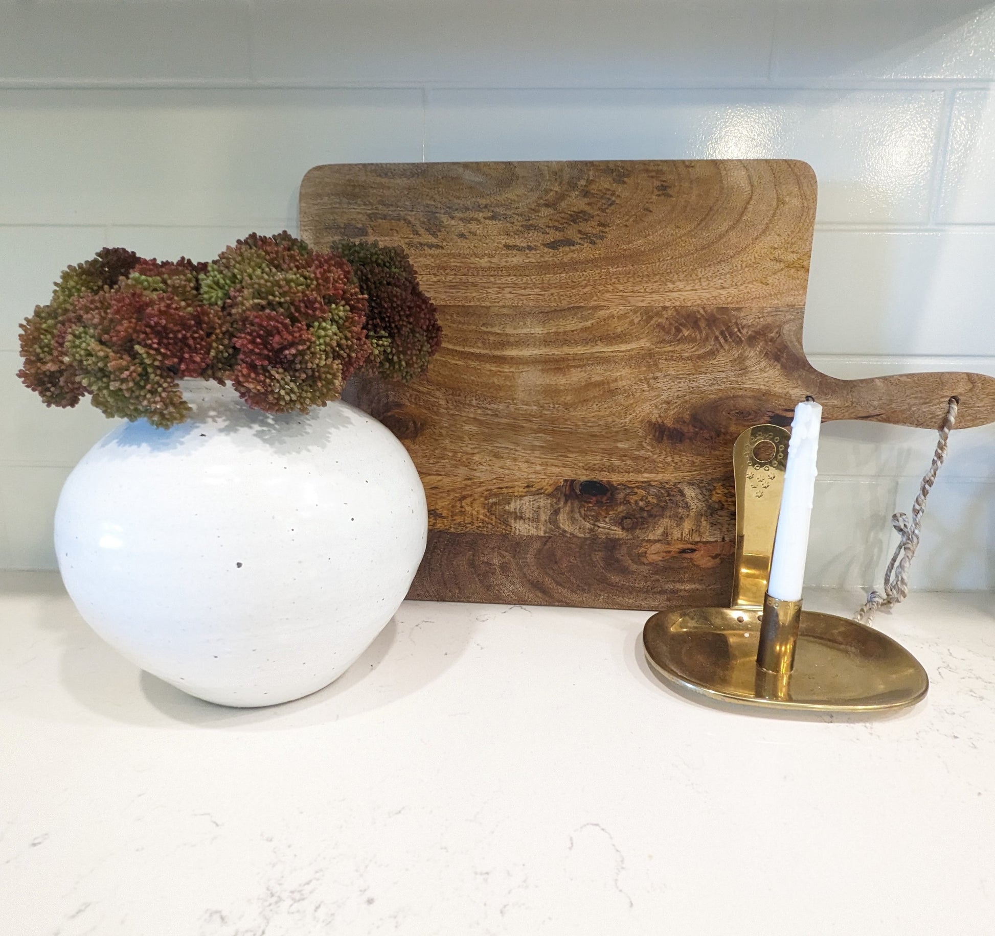 Bouquet of artificial  fall allium spray flowers in white vsae of lifesetyle photo showcasing Fall home decor ideas.