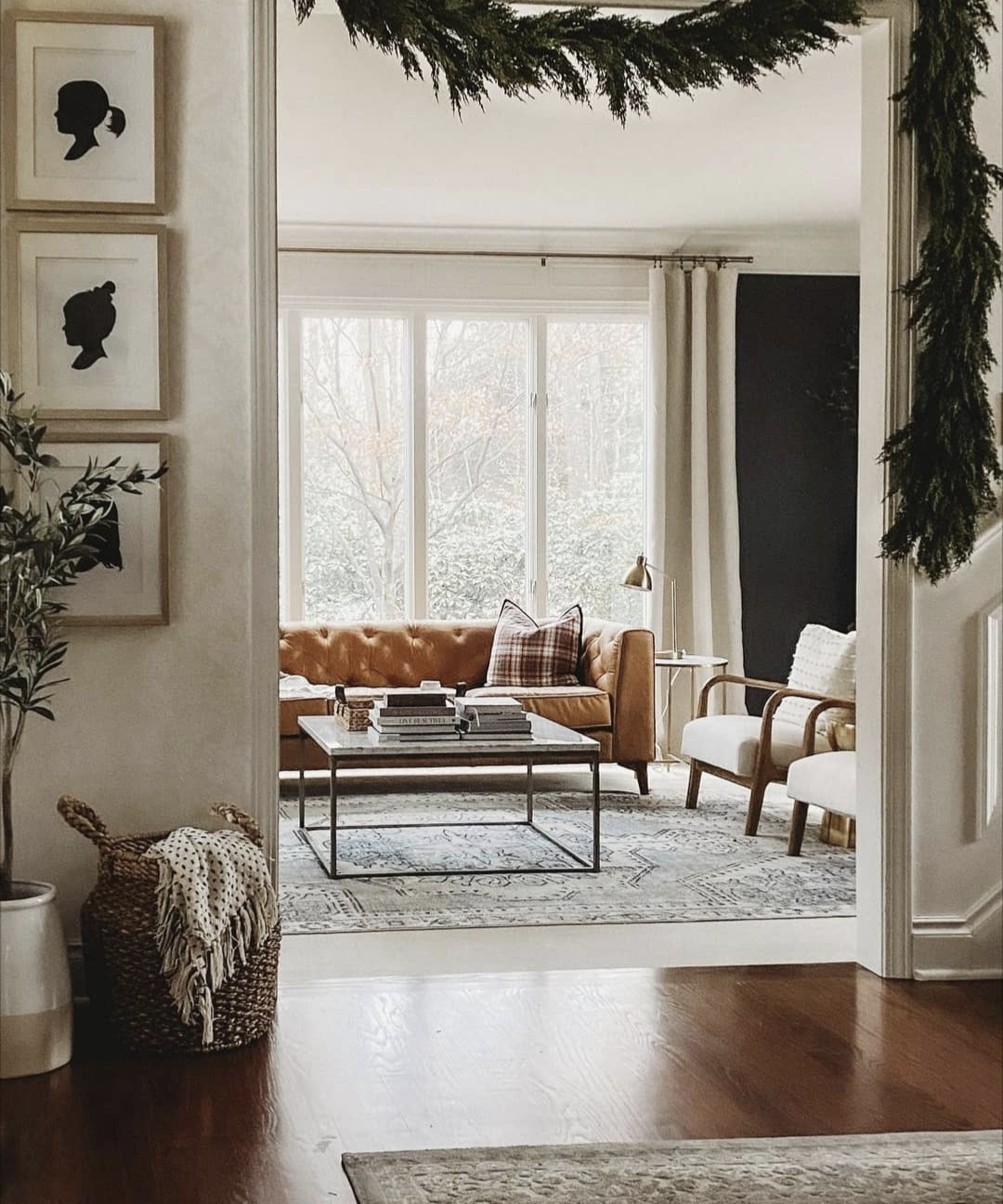 Image of 9 ft artificial real touch cedar garlands hanging over doorway in home for holiday and Christmas decorating.