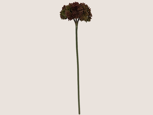 Artificial fall allium spray flower against a beige background showcasing green stem with prominently dark red blooms with gradient of green and brown creating lifelike faux flower.