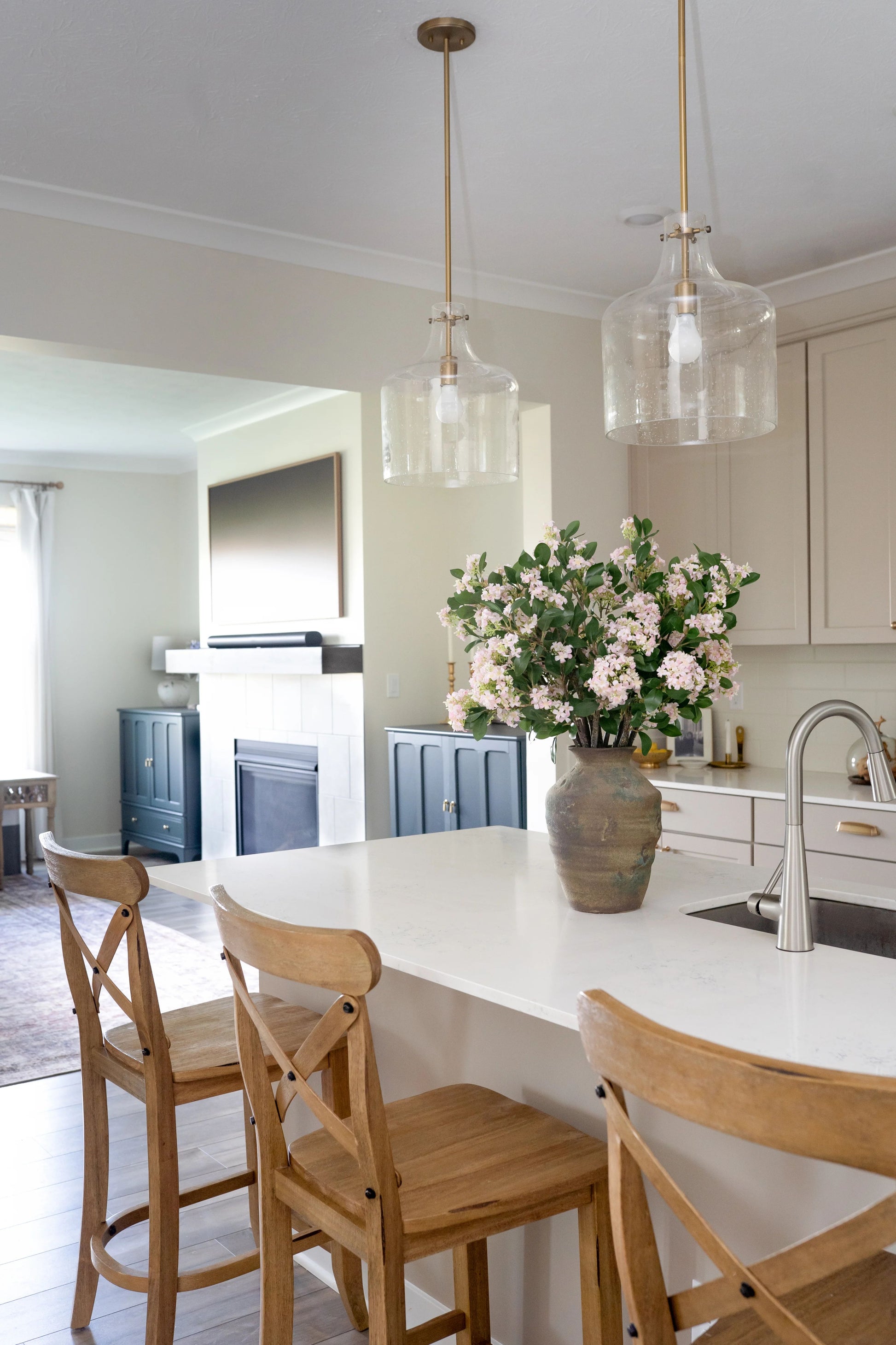 Bouquet of pink lilacs in a terra cotta vase.