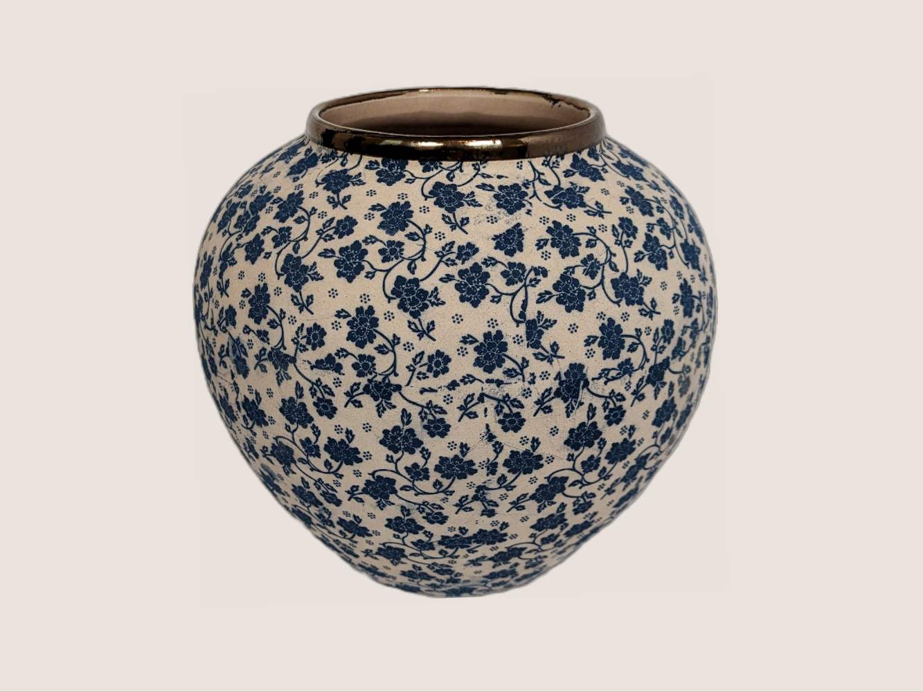 Round vase with ivory and blue floral decal. Gold rim accent for home decor with underglaze effect and matte finish.