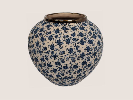 Round vase with ivory and blue floral decal. Gold rim accent for home decor with underglaze effect and matte finish.
