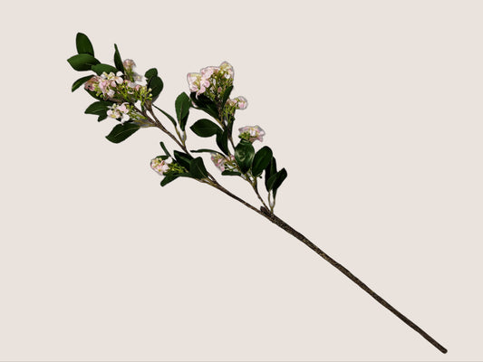 Image of an artificial lilac stem that stands 30 inches tall, featuring lifelike details such as white, pink, and light green petals with dark brown stem. The buds are light green and the stem has realistic texture and detailing. The stem is shown against a neutral beige background.