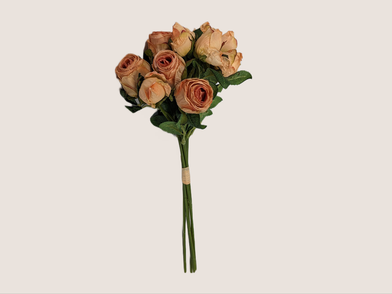 An image of a bouquet of 5 pink roses crafted to look like preserved roses instead of fresh ones. Each stem is 14 inches tall and features two flower heads per green stem. The flowers are pink with light brown edging to look dried, adding to the realistic appearance. The image is against a neutral beige background, showcasing the delicate beauty of the preserved roses.