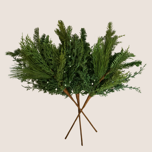 3 stems of artificial mixed evergreen stems featuring mix of juniper, cedar, balsam fir, and ponderosa pine against blush background. 