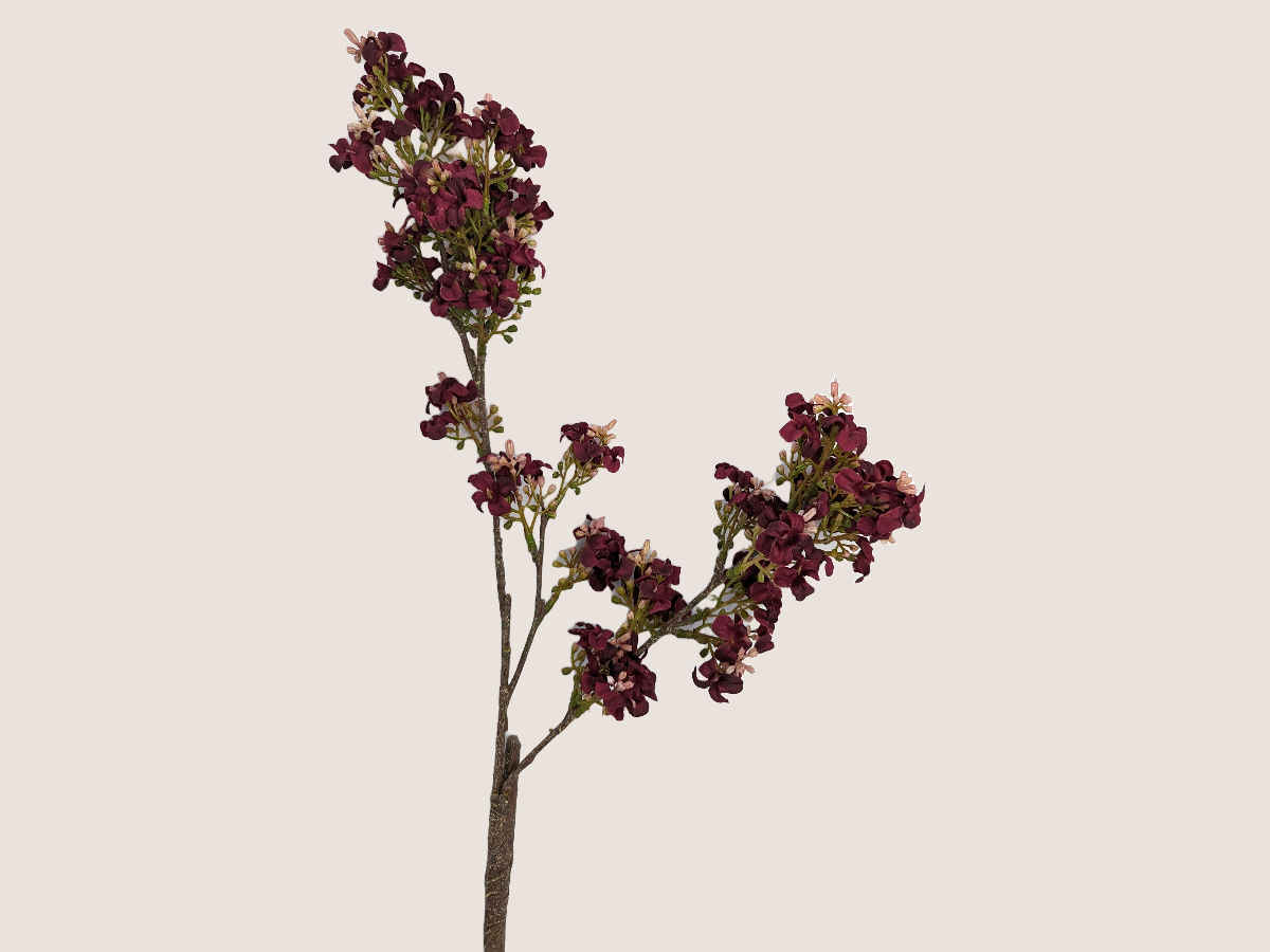 Faux floral dark pink burgundy fall stem with light pink accents and realistic branch against a beige backdrop. 