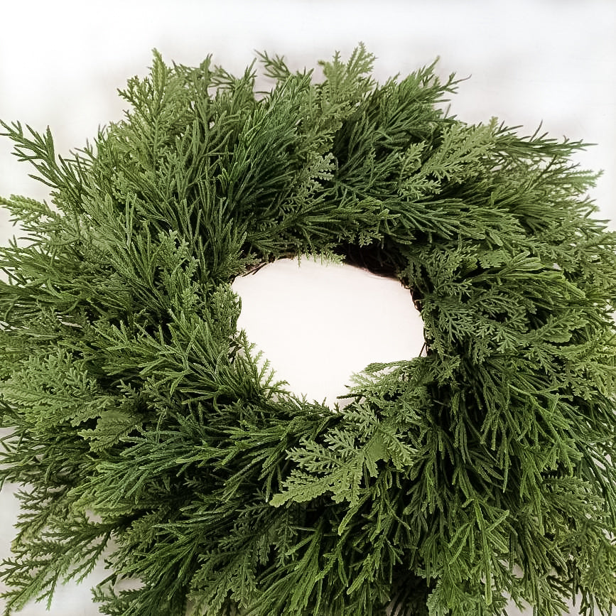 14 inch holiday decor wreath. Made with artificial greenery of mixed greenery types for realistic look. Prfect for Holiday Christmas decorating on windows, backs of chairs, mirrors and interior doors.