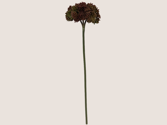Artificial fall allium spray flower against a beige background showcasing green stem with prominently dark red blooms with gradient of green and brown creating lifelike faux flower. 