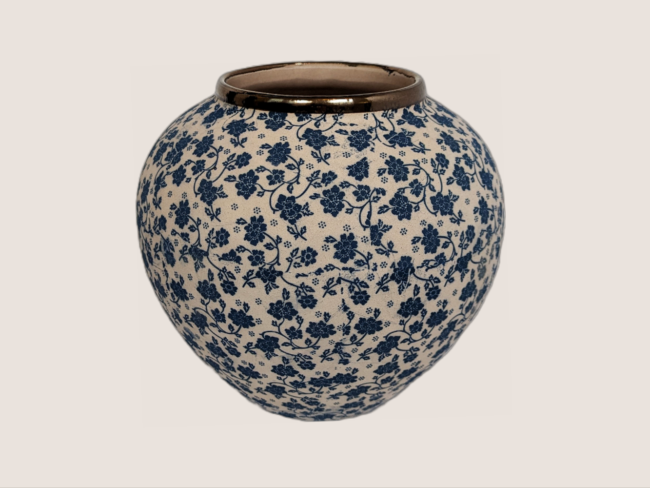Round vase with ivory and blue floral decal. Gold rim accent for home decor with underglaze effect and matte finish. 