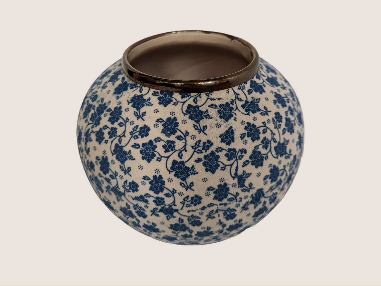 Round ivory and blue floral decal vase with gold rim accent for home decor. Features underglaze effect and matte finish.