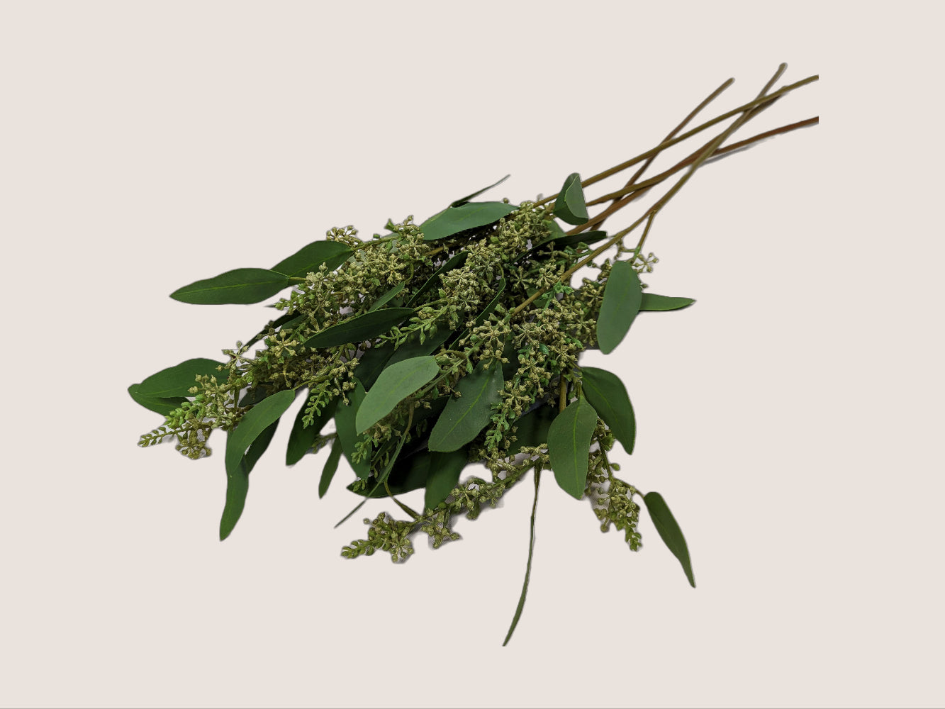 An image of bouquet of five artificial seeded eucalyptus branches against a white background. The branches are 28 inches long and features lifelike sage green leaves with realistic veining and texture. The seeded eucalyptus branch adds natural and organic charm to any floral arrangement or home decor. The image showcases the intricate details and lifelike appearance of the artificial branch, including the color, texture, and shape of the leaves.